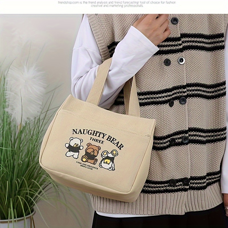 stylish minimalist tote bag with   print lightweight zippered closure fixed shoulder straps cream white khaki black     and casual   casual tote bag   material details 5